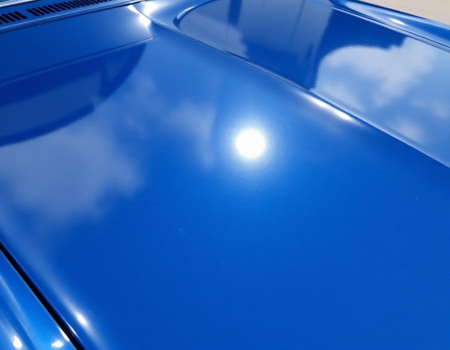 Hood with mirror-gloss blue finish after refinishing